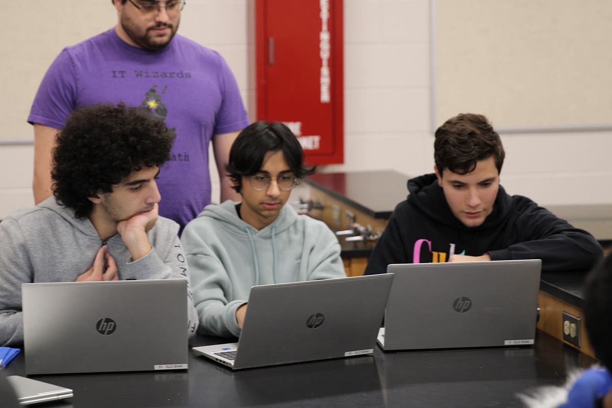 Students Jacob Diry, Ahmed Virk, and Lorenzo Gaglio practice for an upcoming competition. 
