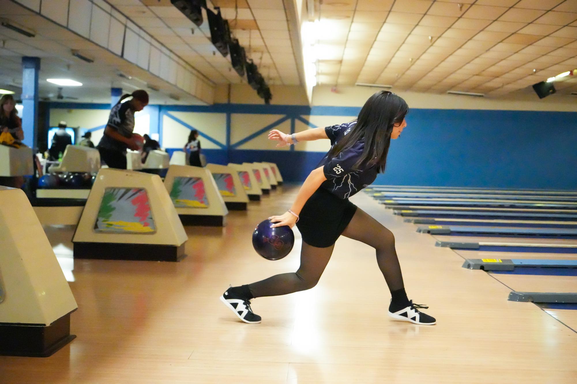 Ashlyn Houston plants her feet and winds up to bowl