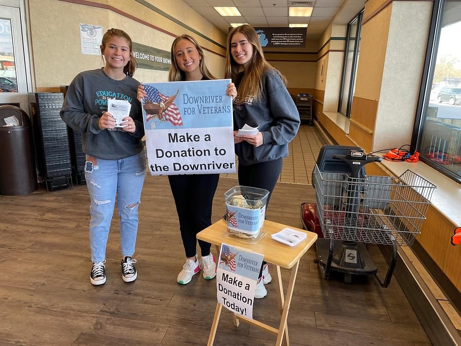 Woodhaven+Deca+students+Mackenzie+Murphy%2C+Jalynn+Wilmot%2C+Lilly+Rushlow%2C+were+at+the+food+drive+helping+out+with+donations+to+raise+money+for+our+veterans.+